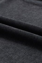 Black ribbed knit sweatshirt fabric detail