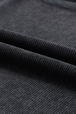 Black ribbed knit sweatshirt fabric detail