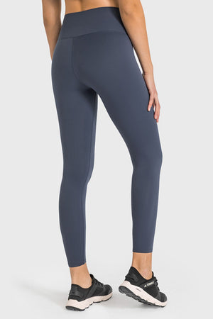 Sculpted high-waist performance leggings in gray, ankle length.