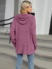Ribbed knit henley hoodie in mauve with a hood and button detail.