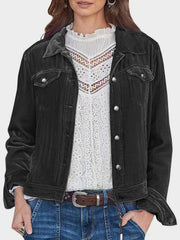 Black velvet western jacket with silver buttons and chest pockets.