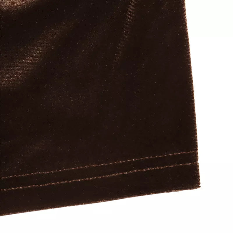 Brown velvet blouse with lace trim detail and V-neck.