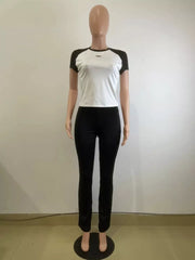Chic contrast two-piece set: white tee with black sleeves and black pants.