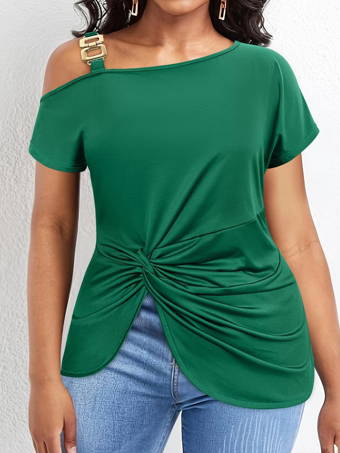Dark green asymmetric tee with buckle detail and knotted hem