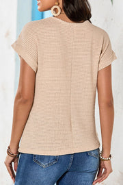 Beige waffle knit top with short sleeves and lace yoke detail.