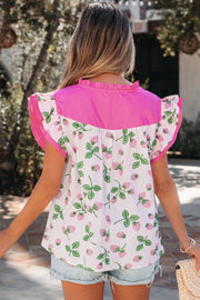 Strawberry print cotton blend blouse with pink color block and flutter sleeves.