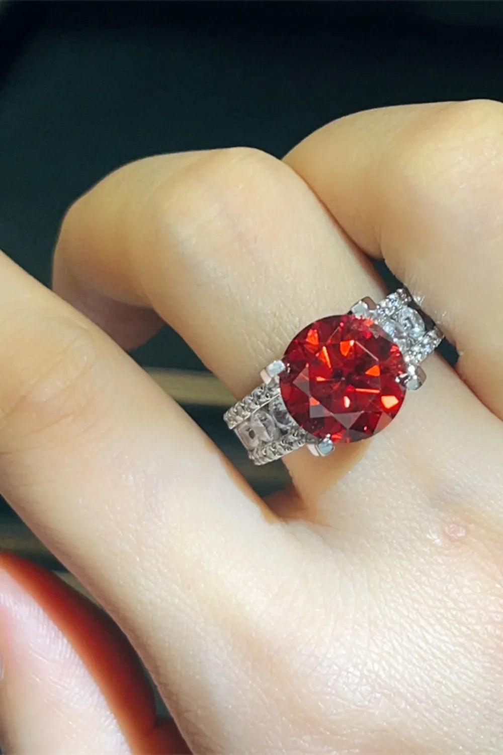 Crimson solitaire ring with pave band, scarlet stone, silver tone metal