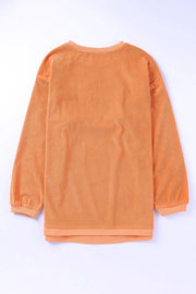 Textured sherbet crewneck sweatshirt with ribbed fabric and long sleeves.