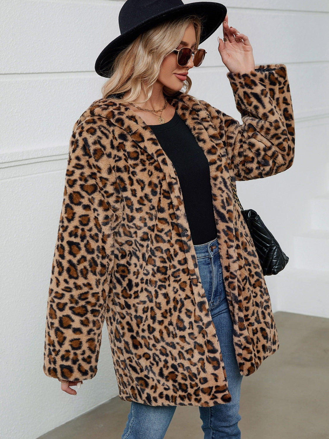 Leopard print faux fur cocoon coat with a relaxed fit and open front.