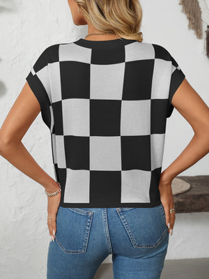 Checkerboard knit top in black and white with cap sleeves and a crew neck.