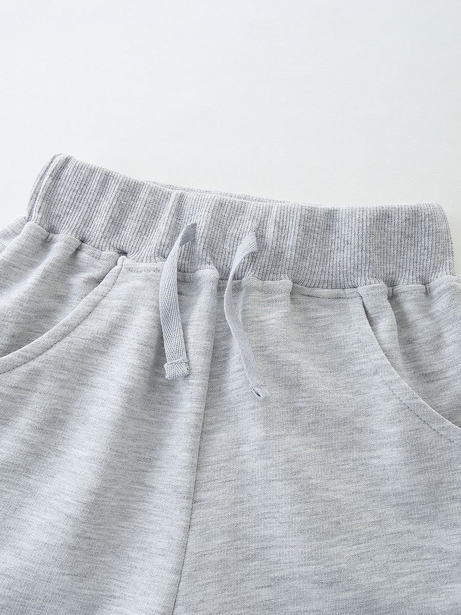 Toddler boys' grey cotton sweat shorts with drawstring waist and pockets.