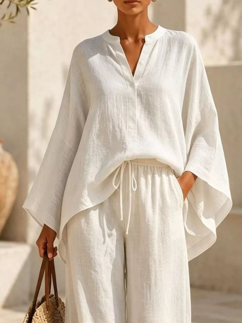 Notched Long Sleeve Top And Wide-leg Pants Set in White, model styling view