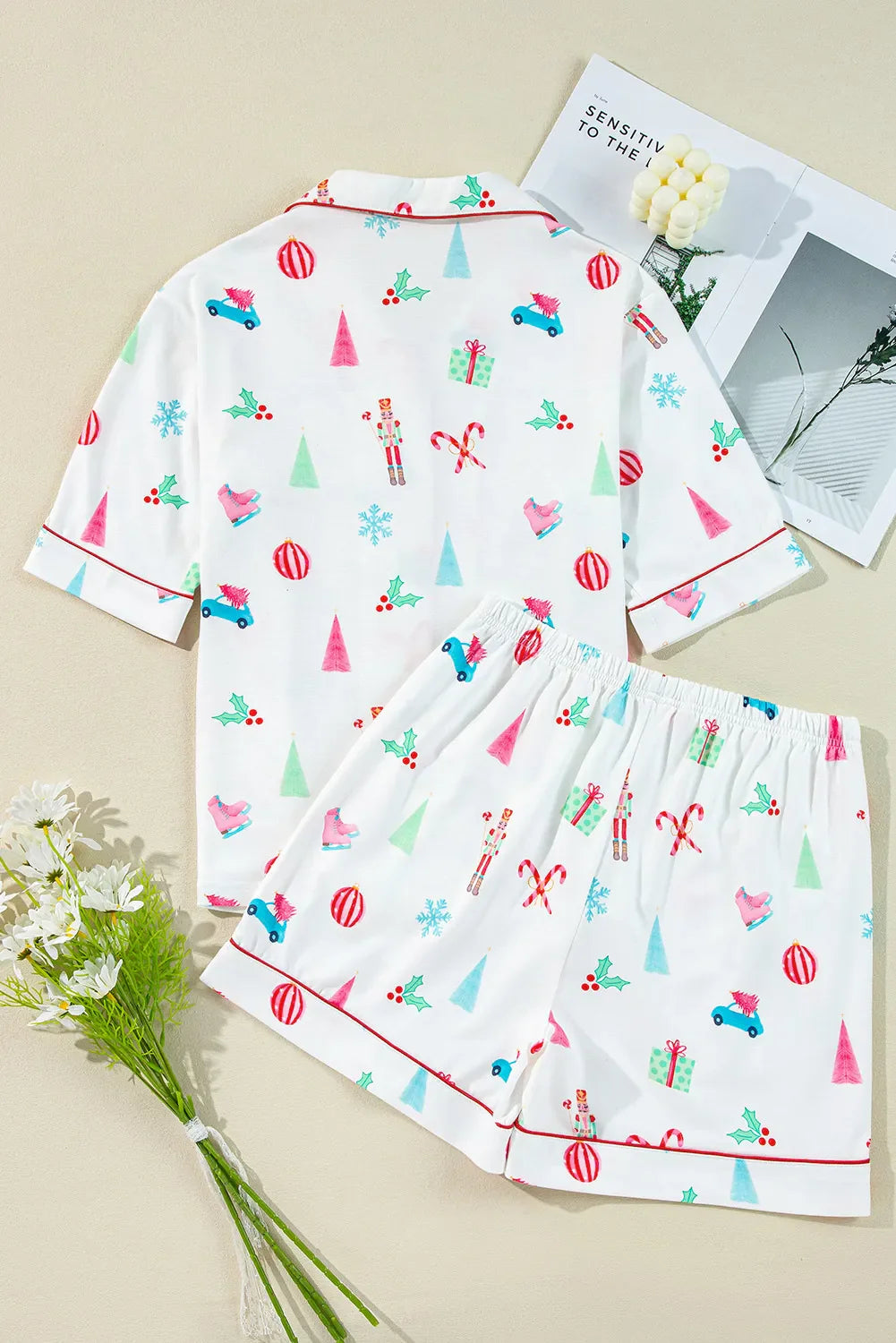 White cotton pajama set with festive Christmas print and contrast piping.