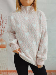 Textured turtleneck sweater in blush pink with a heart motif, acrylic knit