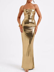 Gold backless ruched maxi dress with a halter neckline and metallic sheen.