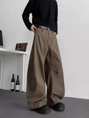 Men's brown baggy sweatpants with pockets and a belted waist.