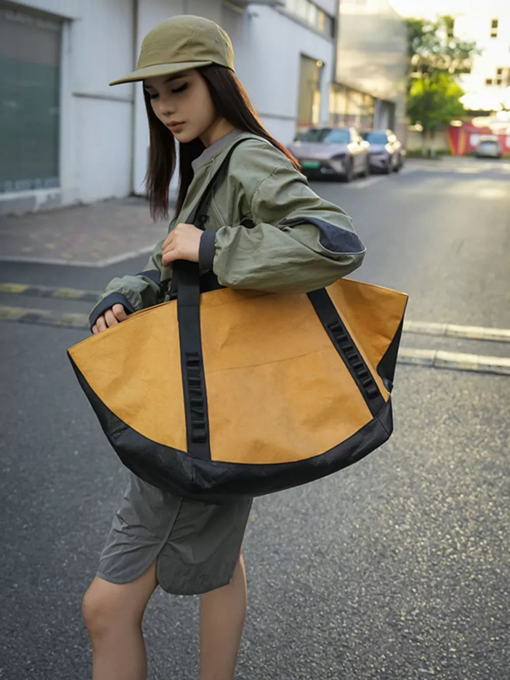 Yellow and black large capacity travel bag with black base and straps.