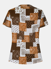 Bandana patchwork henley blouse in brown and white with short sleeves and a buttoned neckline.