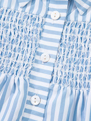 Blue and white striped button-down shirt with shirred bodice and white buttons.