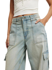 Light blue denim wide leg cargo pants with button closure and multiple pockets.