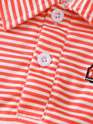 Coral striped cotton baby polo shirt with embroidered firetruck detail and white buttons.