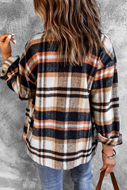 Soft plaid shacket with patch pockets in black, white, tan, and orange.