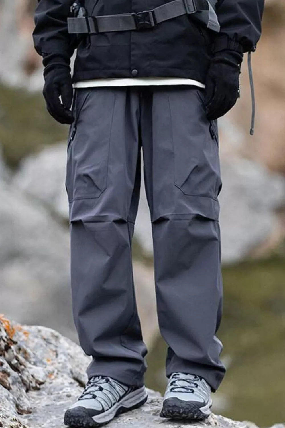 Men's gray cargo pants with multiple pockets and a relaxed fit.