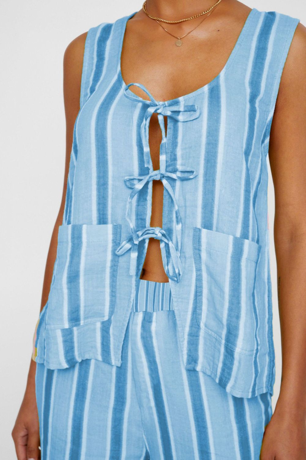 Light blue striped linen co-ord set with tie-front detail and patch pockets.