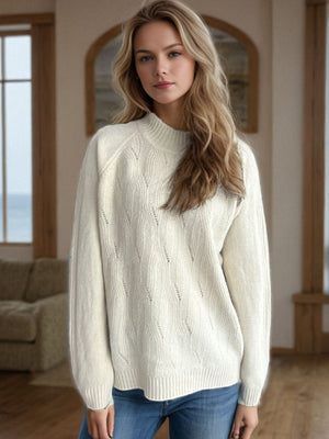 Cream textured knit raglan sleeve pullover sweater with diamond pattern detail.