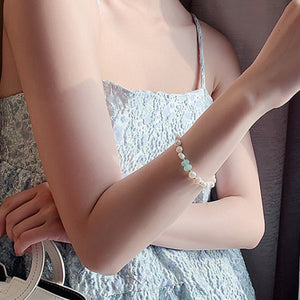 Pearl and green stone toggle bracelet with toggle clasp detail