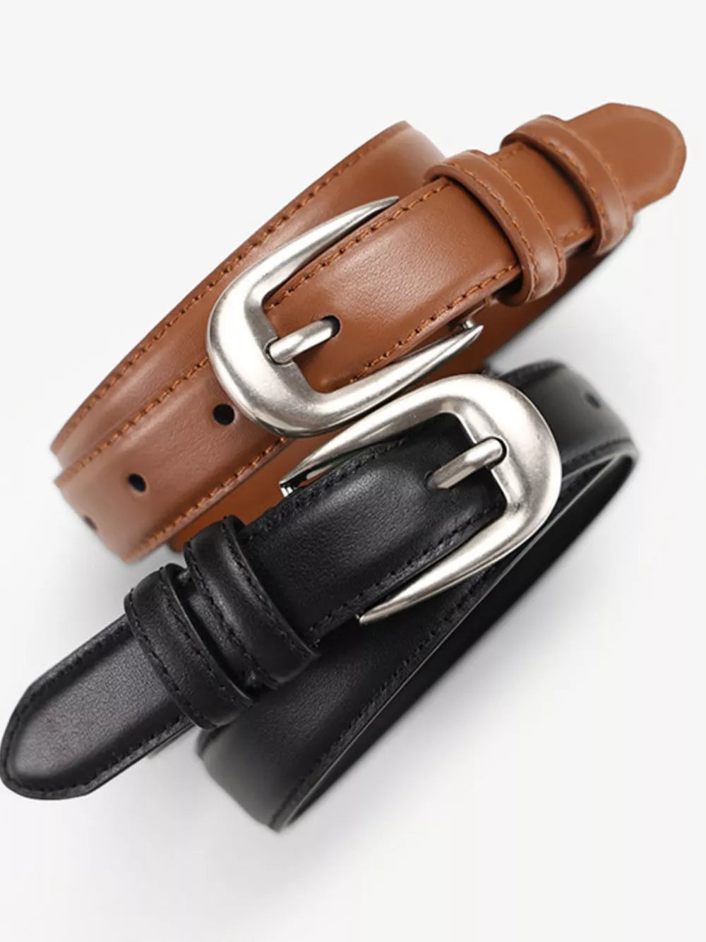 Black and brown cowhide leather belts with silver buckles and accents