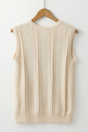 Beige cable knit vest with vertical cable detailing and a crew neckline.