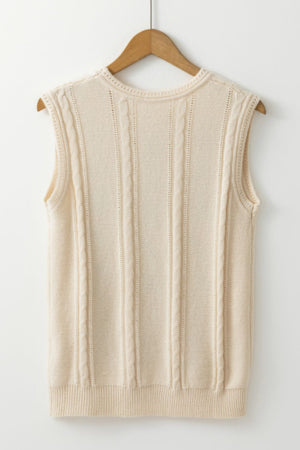 Beige cable knit vest with vertical cable detailing and a crew neckline.