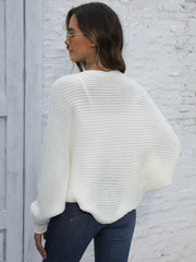 White batwing sleeve knit cardigan with ribbed texture and loose fit.