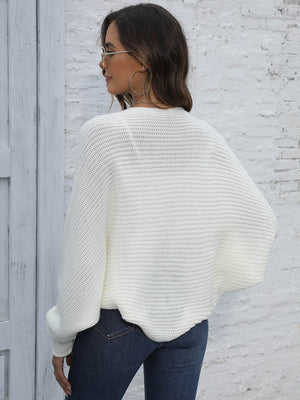 White batwing sleeve knit cardigan with ribbed texture and loose fit.