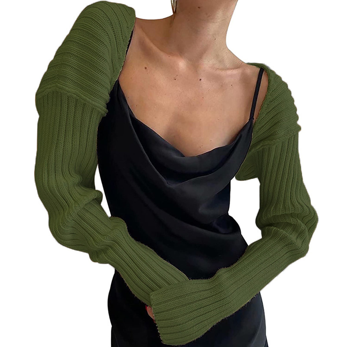 Army green ribbed knit shrug with extended sleeves worn over a black slip dress.