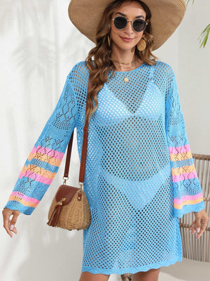 Light blue crochet cover-up with colorful striped sleeves and open knit detail.