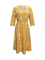 Yellow geometric print midi dress with 3/4 sleeves and notched neckline