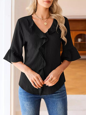 Black maternity shirt with V-neck, cascading ruffles, and 3/4 bell sleeves.