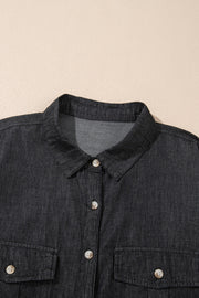 Relaxed black denim shirt with buttoned patch pockets and collar detail.