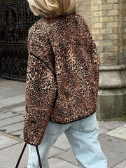 Leopard print boxy jacket with black edge trim, worn by a woman in light wash jeans.