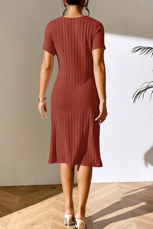 Orange-red ribbed midi dress with short sleeves and a subtle shoulder detail.