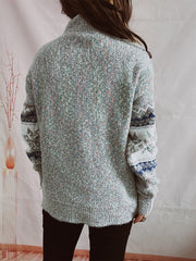 Geometric knit mockneck pullover in Cloudy Blue with patterned sleeves.