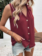 Burgundy sleeveless collared button-down blouse with a V-neck.