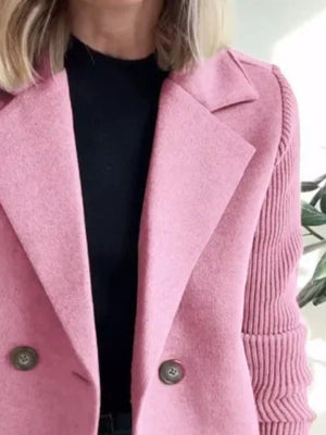 Pink double-breasted trench coat with knit sleeves and button details