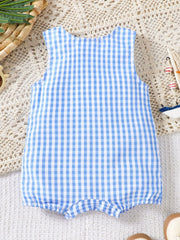 Blue gingham one-piece romper with sailboat appliqué detail.