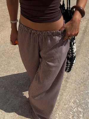 Tied striped wide-leg pants in brown and pink with an elastic waistband.