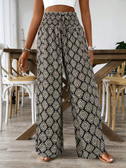 Geometric print wide leg pants in black and white with a drawstring waist.