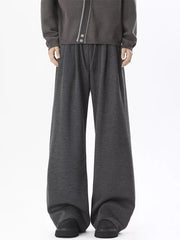 Gray wide-leg sweatpants with adjustable drawstring waist and relaxed fit.