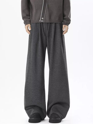 Gray wide-leg sweatpants with adjustable drawstring waist and relaxed fit.